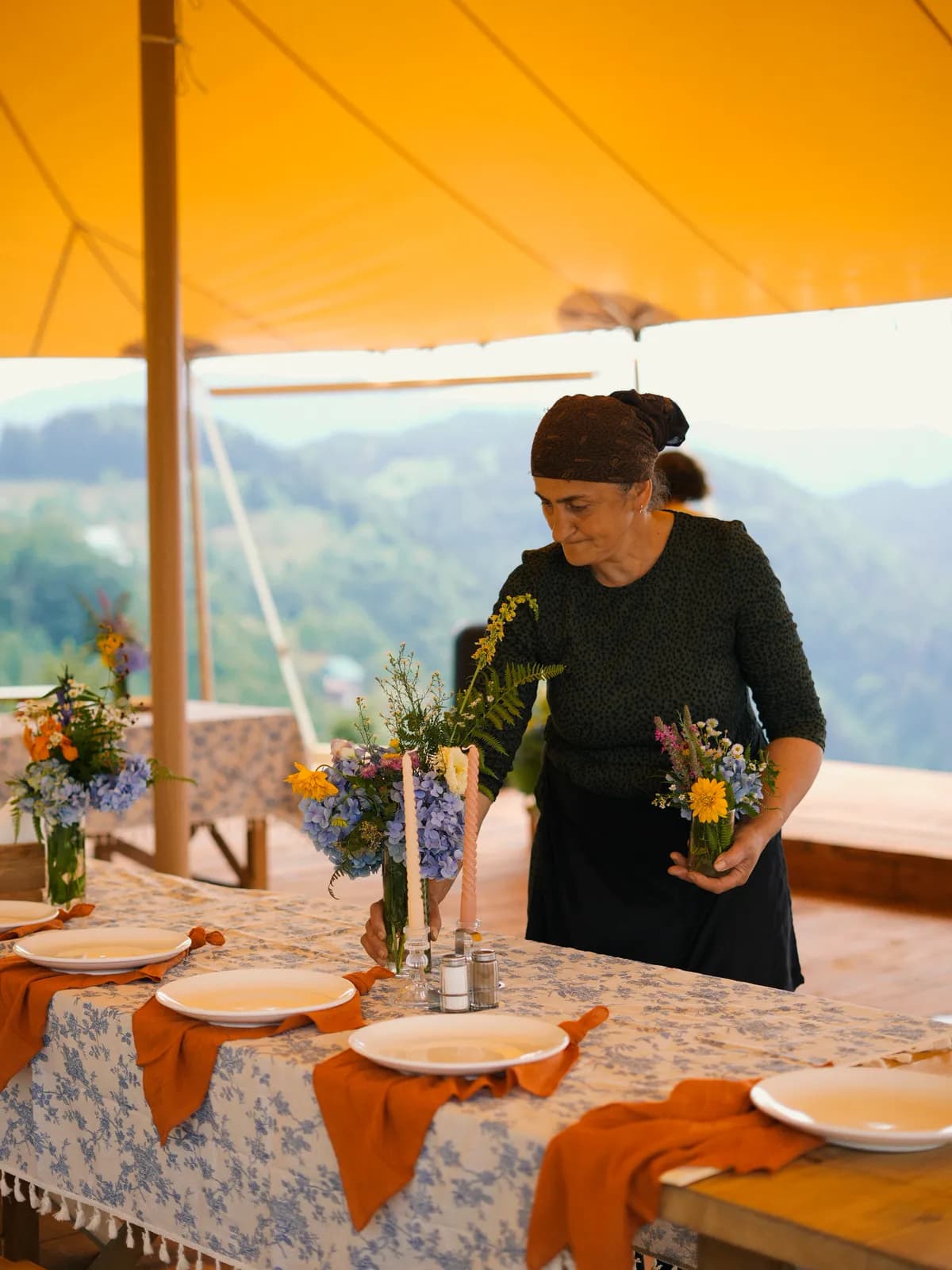 The table being decorated with wildflowers
