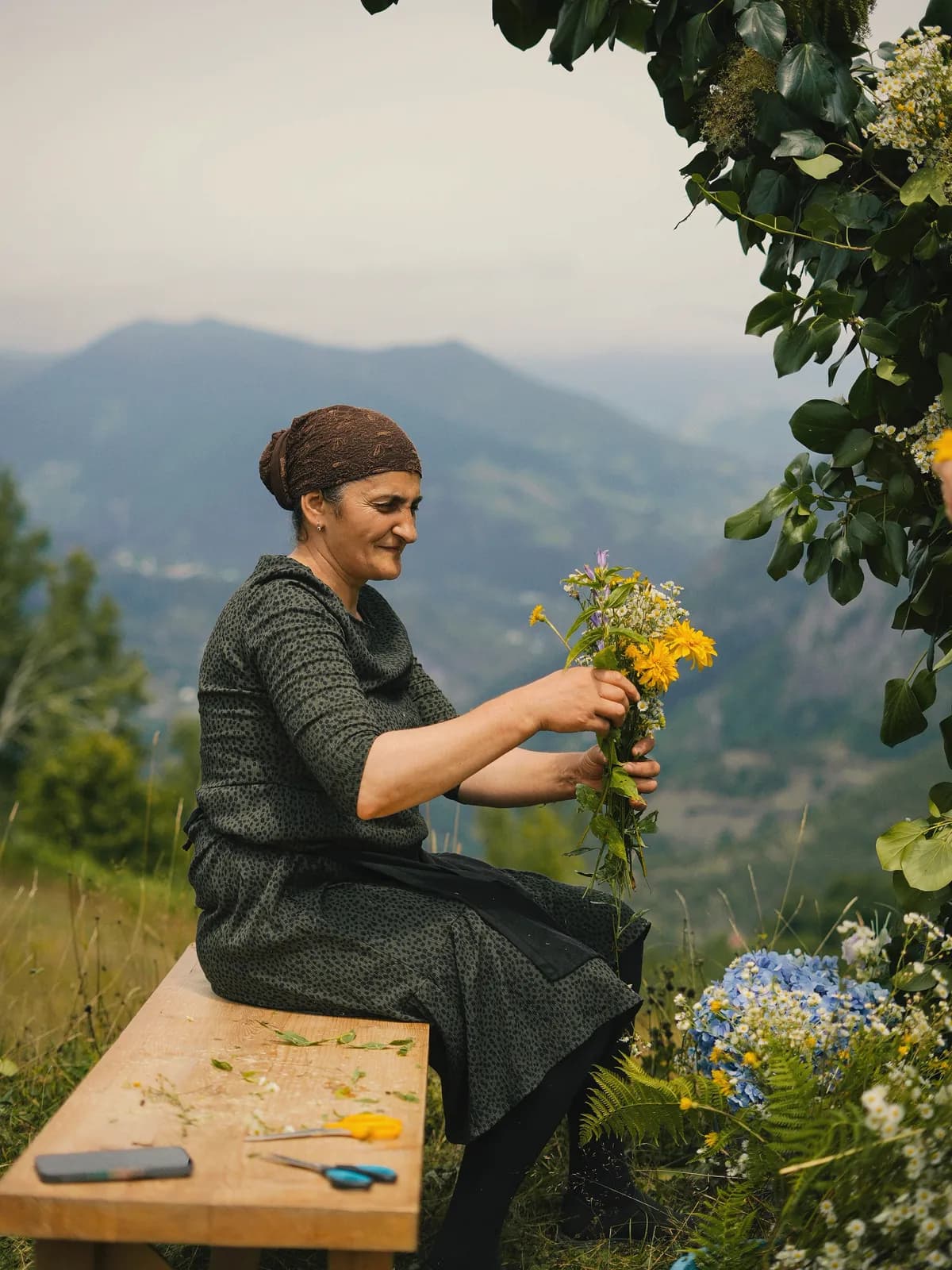 A local woman arranging wildflower bouquets